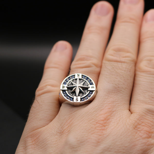 A hand wearing the Stronzen compass ring, symbolizing a chosen path.