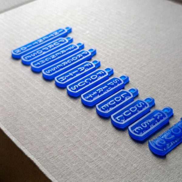Wax models of STRONZEN amulet pendants lying side by side